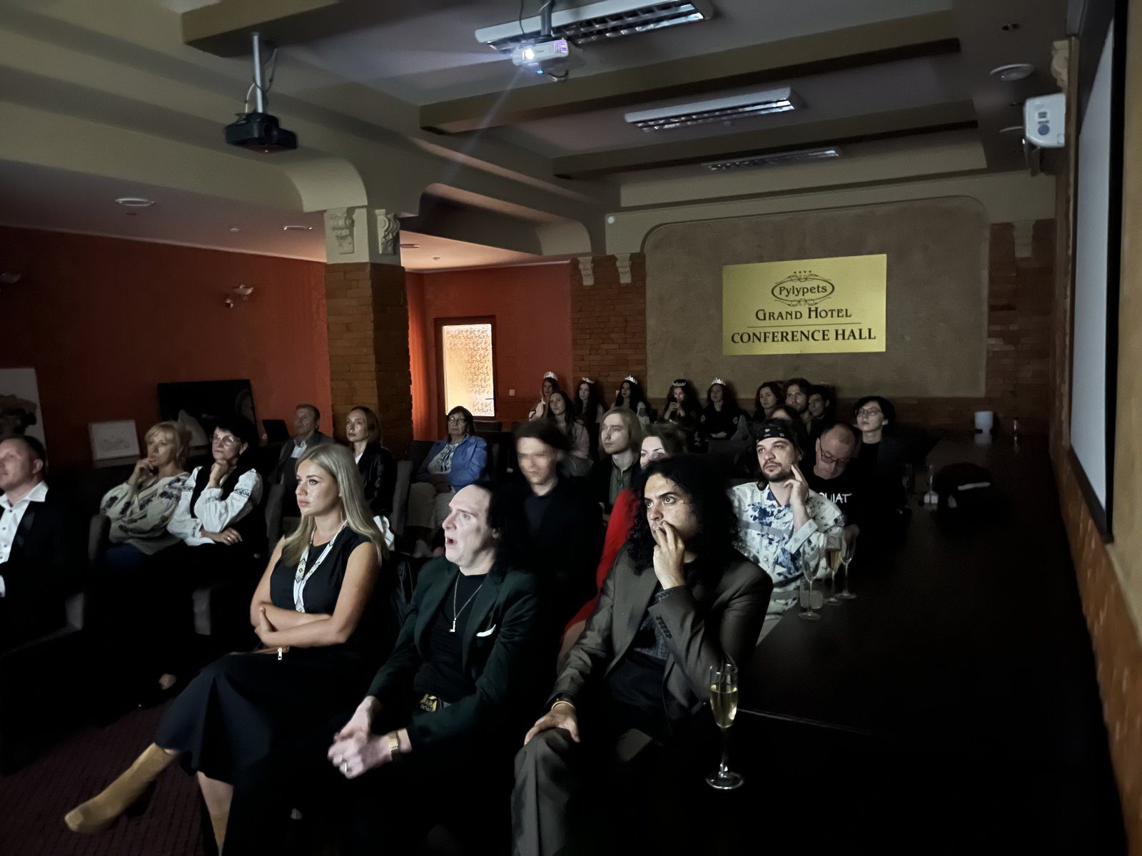 Audience watching screenings in the conference hall of Grand Hotel Pylypets